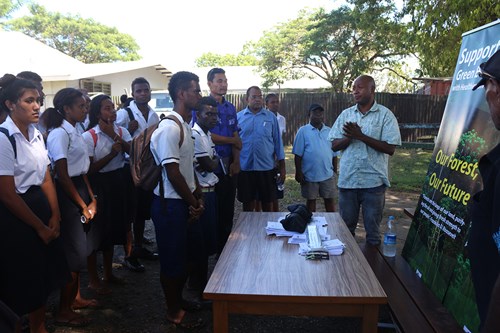 Bradford Theonomi (far right) of the Ministry of Forestry and Research talking about career opportunities in the forestry sector.
